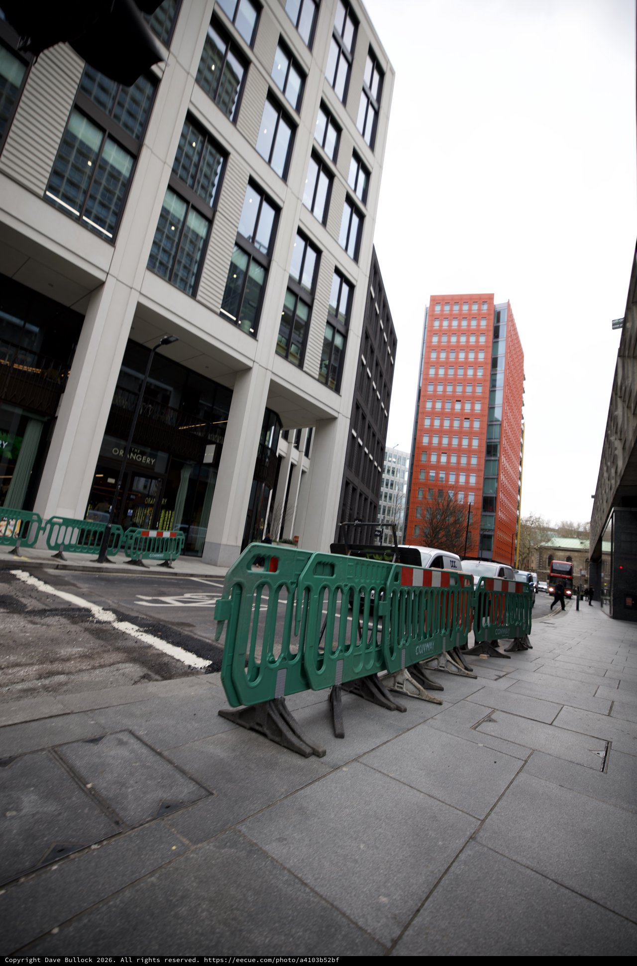Modern Urban Development with Green Construction Barriers in London