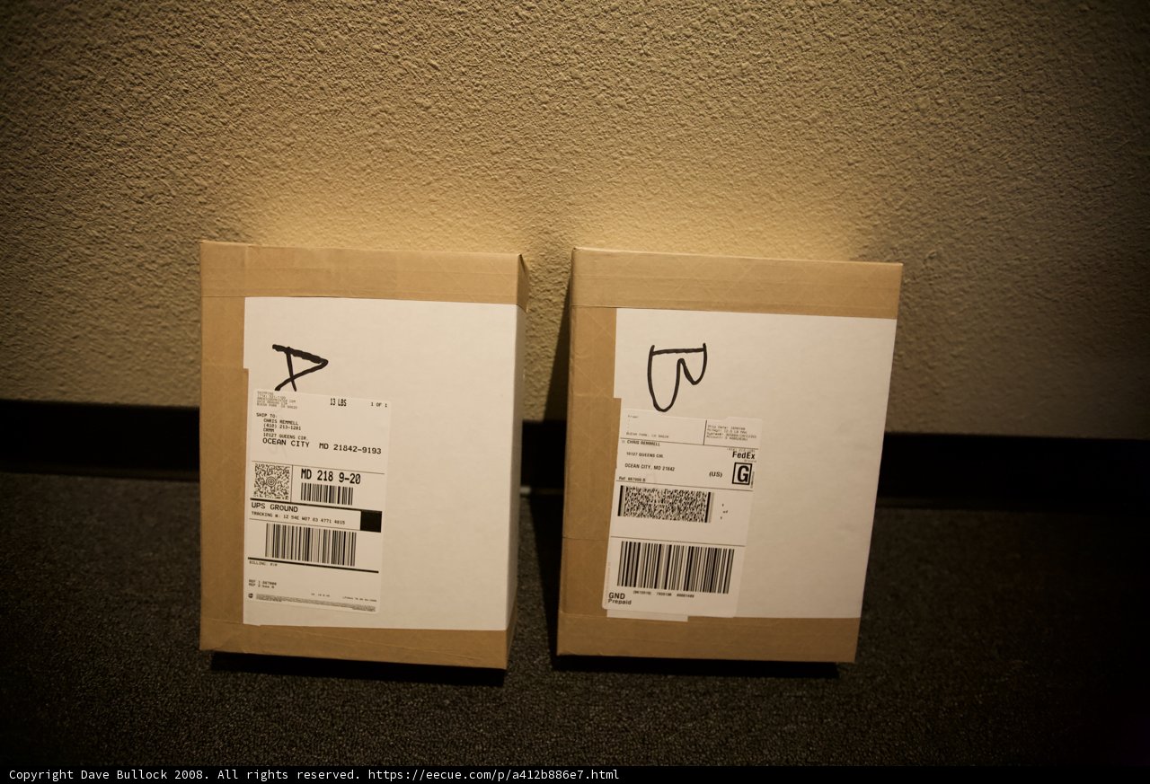 Two Boxes Marked with 'B' on a Table
