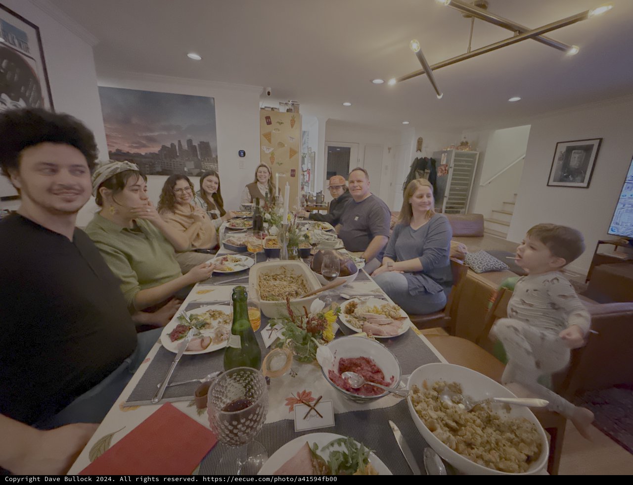 Family Thanksgiving Dinner Gathering Around Table