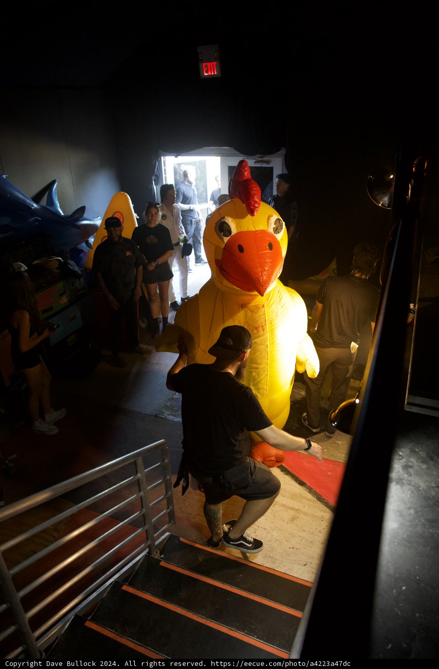 Backstage Eccentricity: The Giant Inflatable Rooster at Coachella 2024