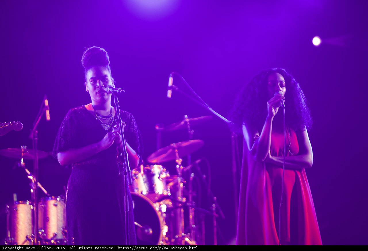 Solange And Backing Vocalist Singing Red Black Drum Kit Spotlight Purple