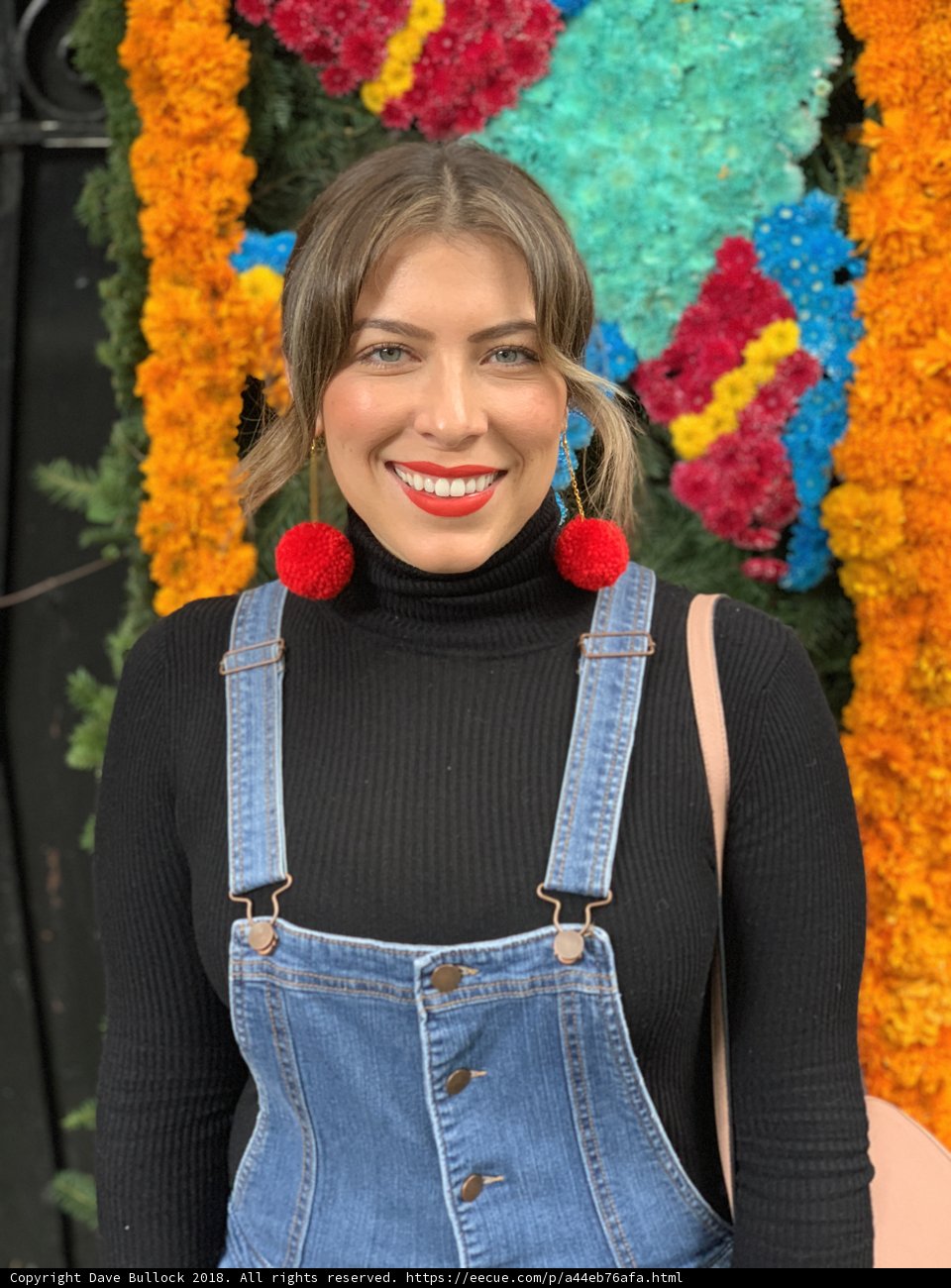 Smiling Woman in Overalls