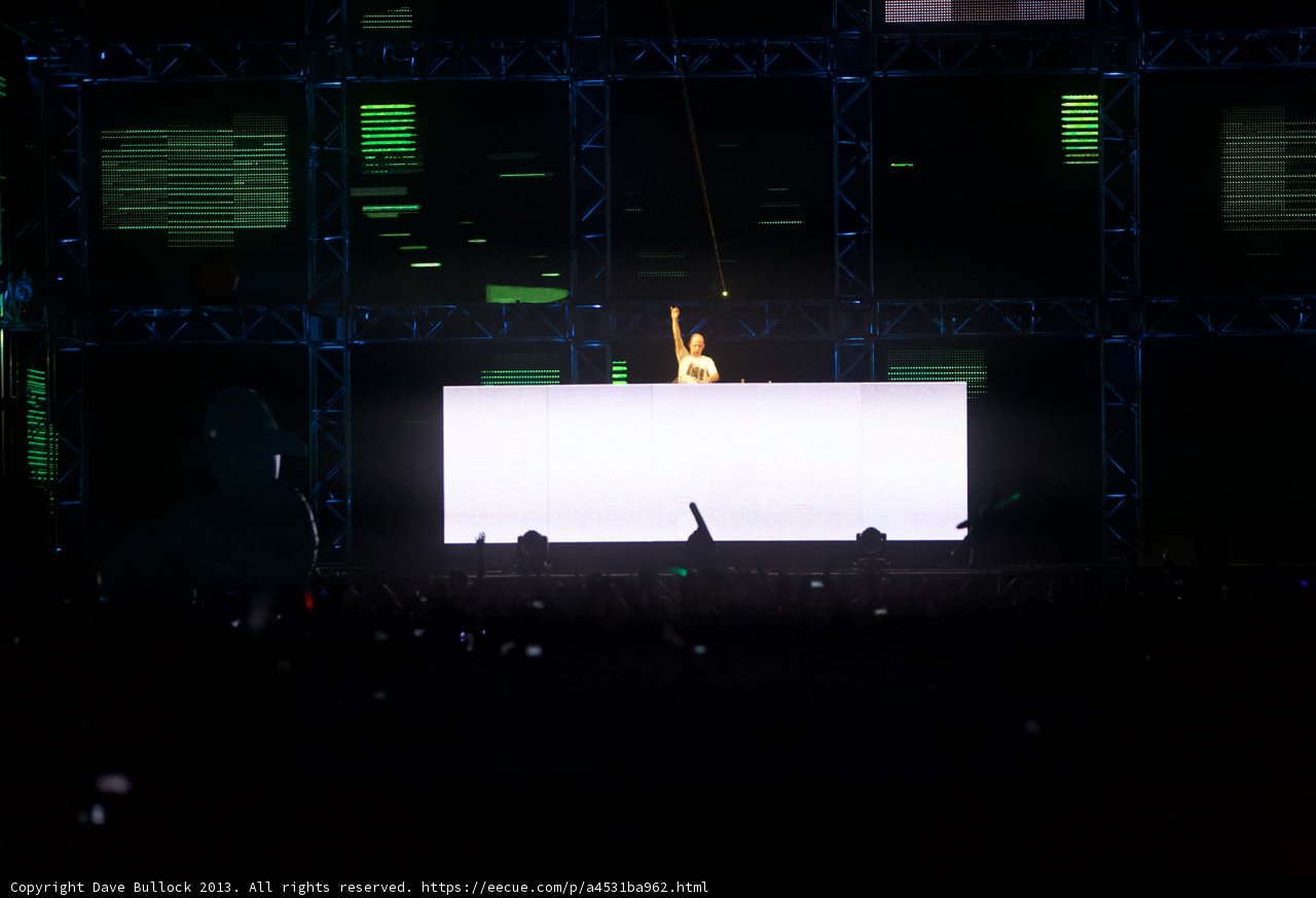 Man on Stage with Large Screen