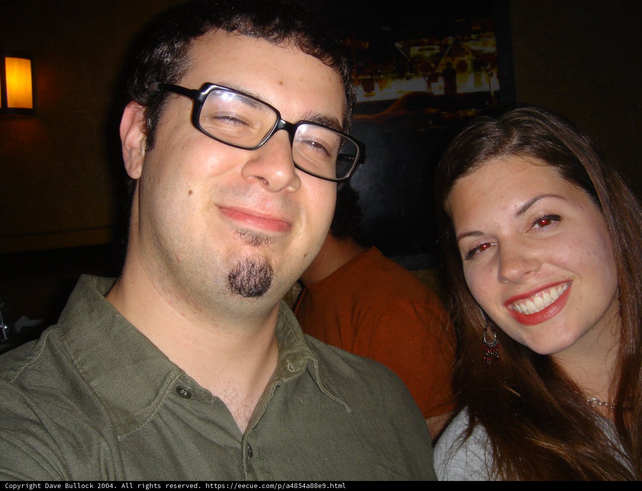 A Happy Couple Wearing Glasses