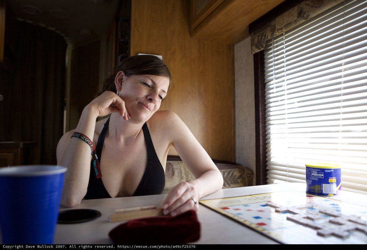 Contemplative Woman Playing Scrabble in RV