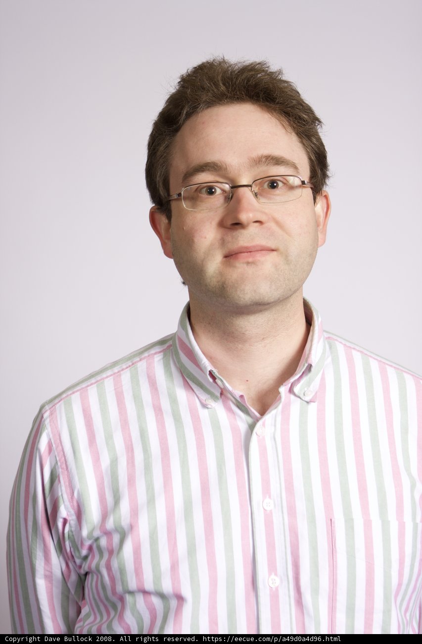 Stylish Man with Glasses and a Striped Shirt