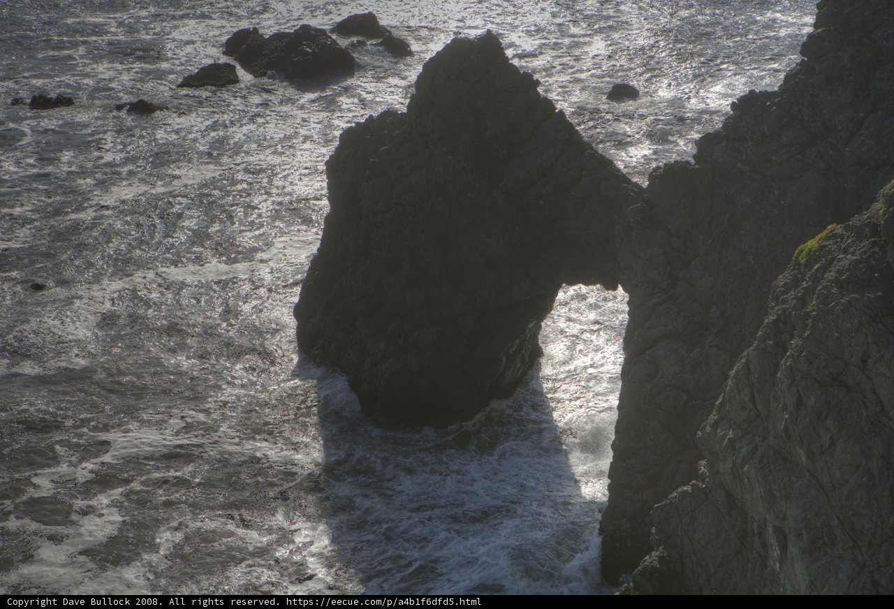 Majestic rock formation standing strong against the sea