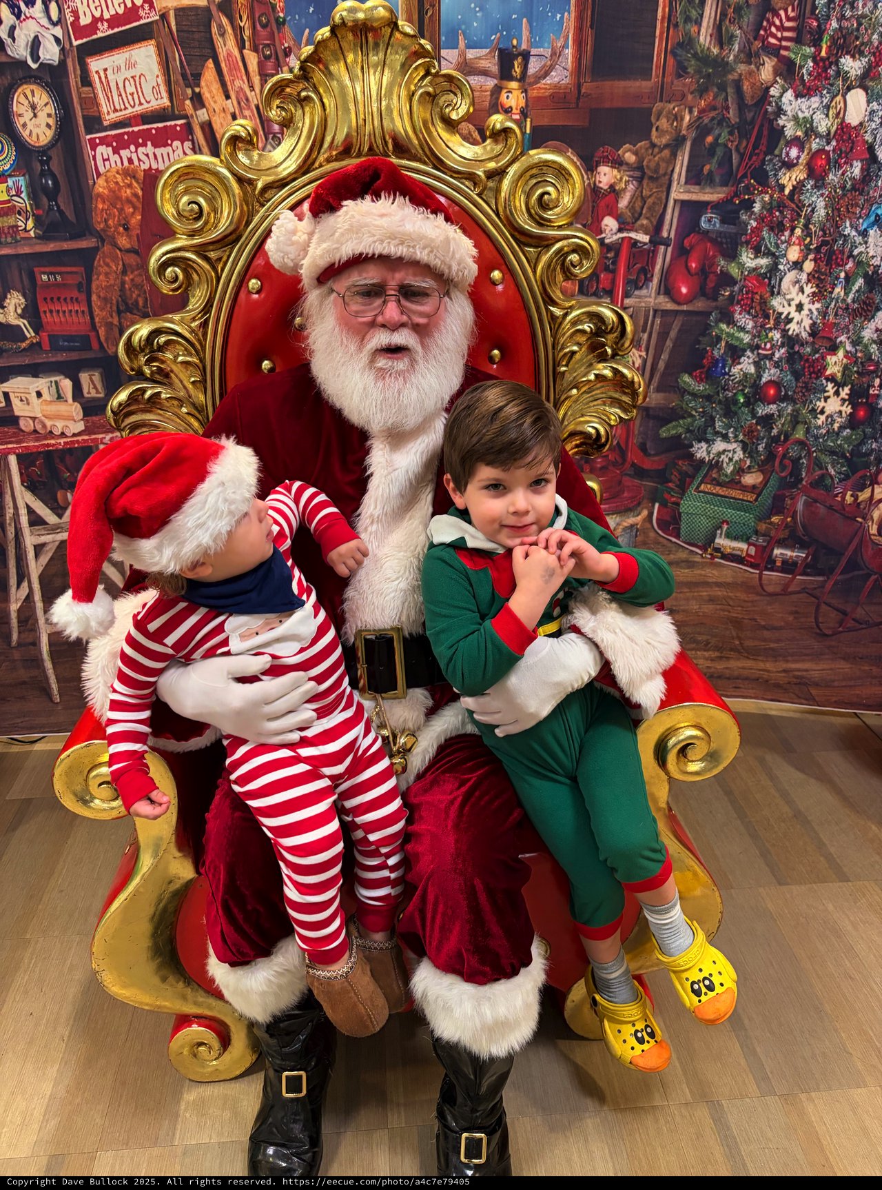 Two Children Visit Santa in His Ornate Christmas Throne