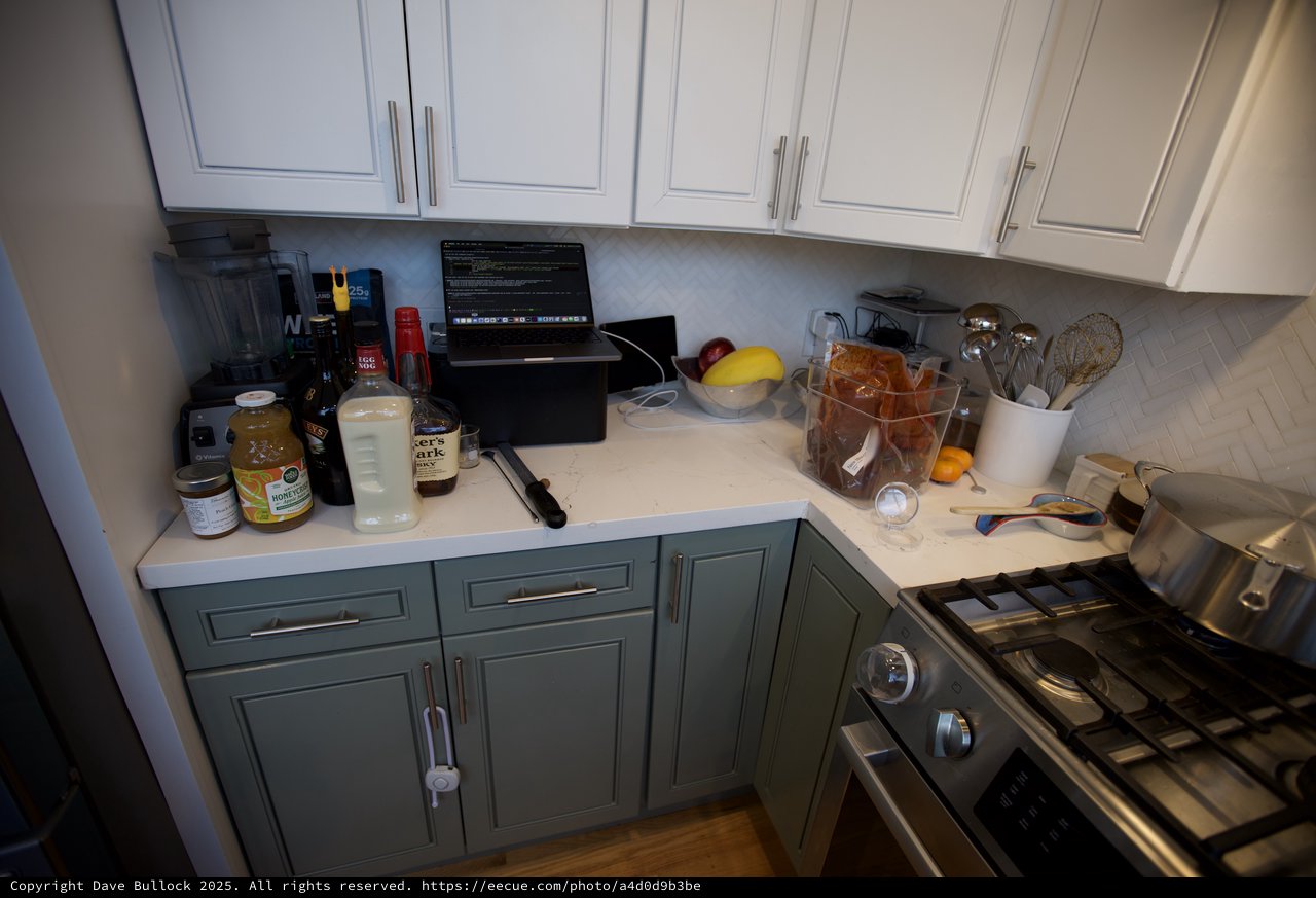 Modern Kitchen Corner with Two-Tone Cabinetry and Workspace