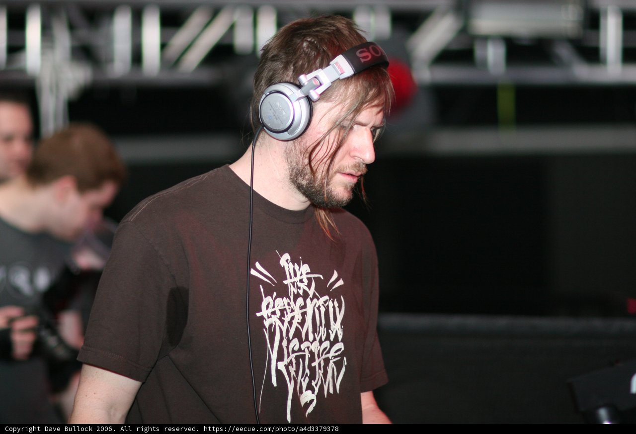 Entertainer in Black Shirt and Headphones