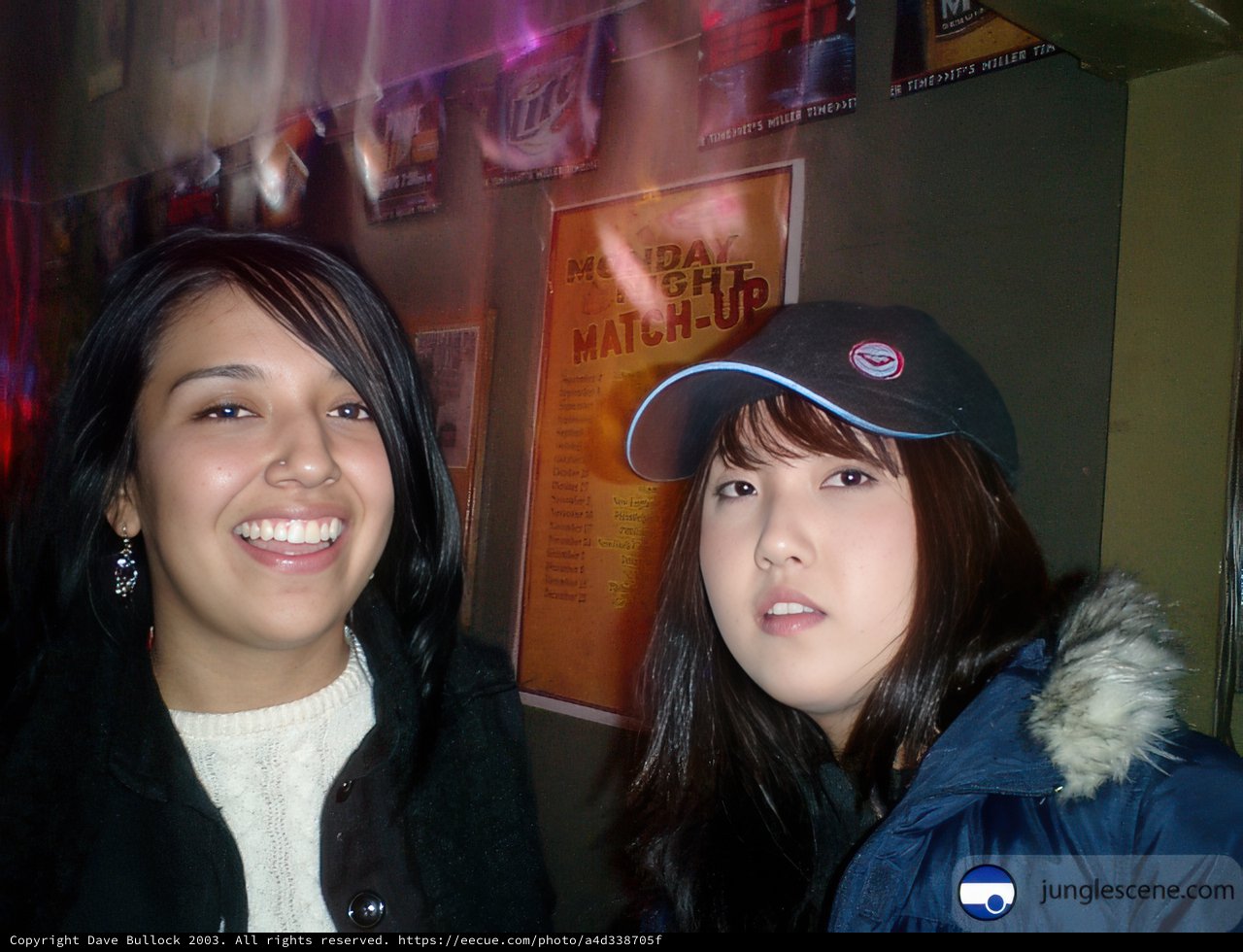 Smiling Girls in Urban Clothing and Baseball Hats
