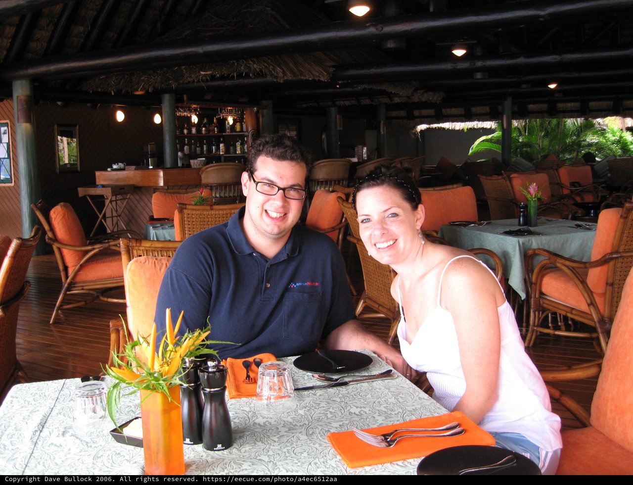 Couple Smiling at Tropical Resort Restaurant Dinner