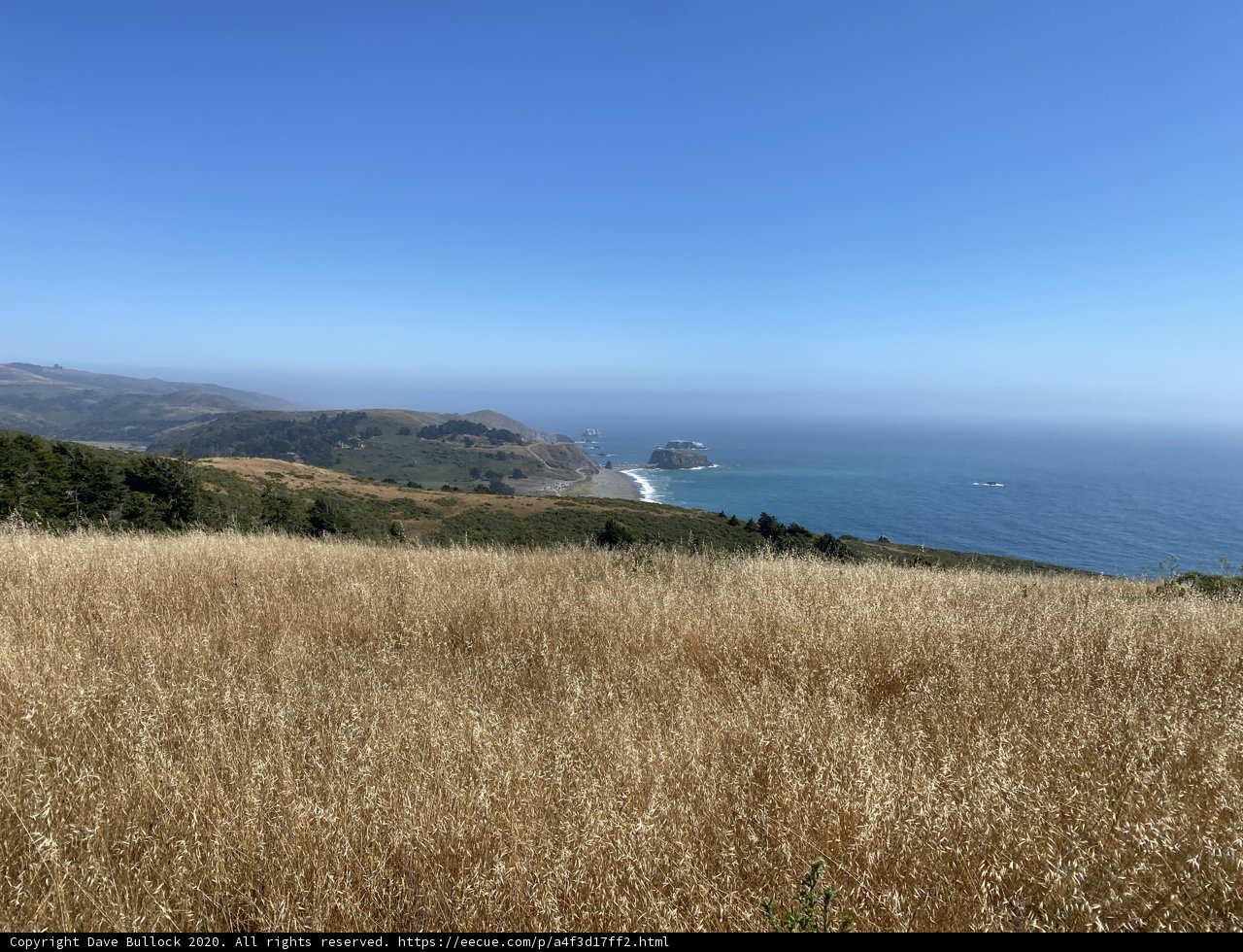 Promontory Overlooking the Majestic Ocean and Hills