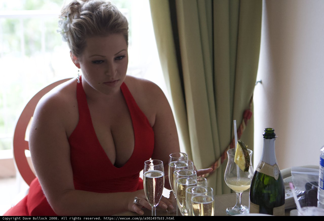 Lady in Red Sips Wine by the Window