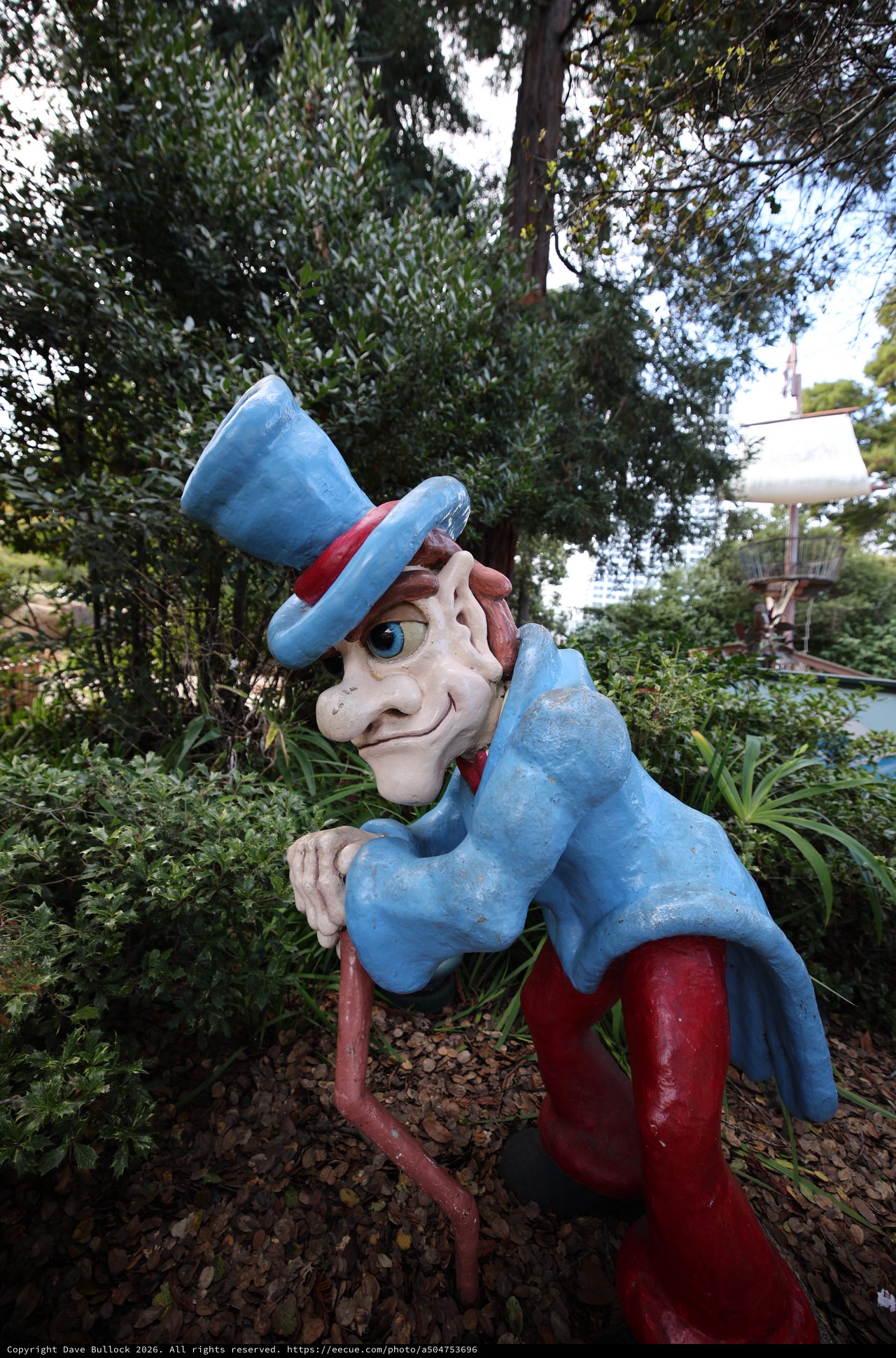 Weathered Uncle Sam Statue in Garden Setting