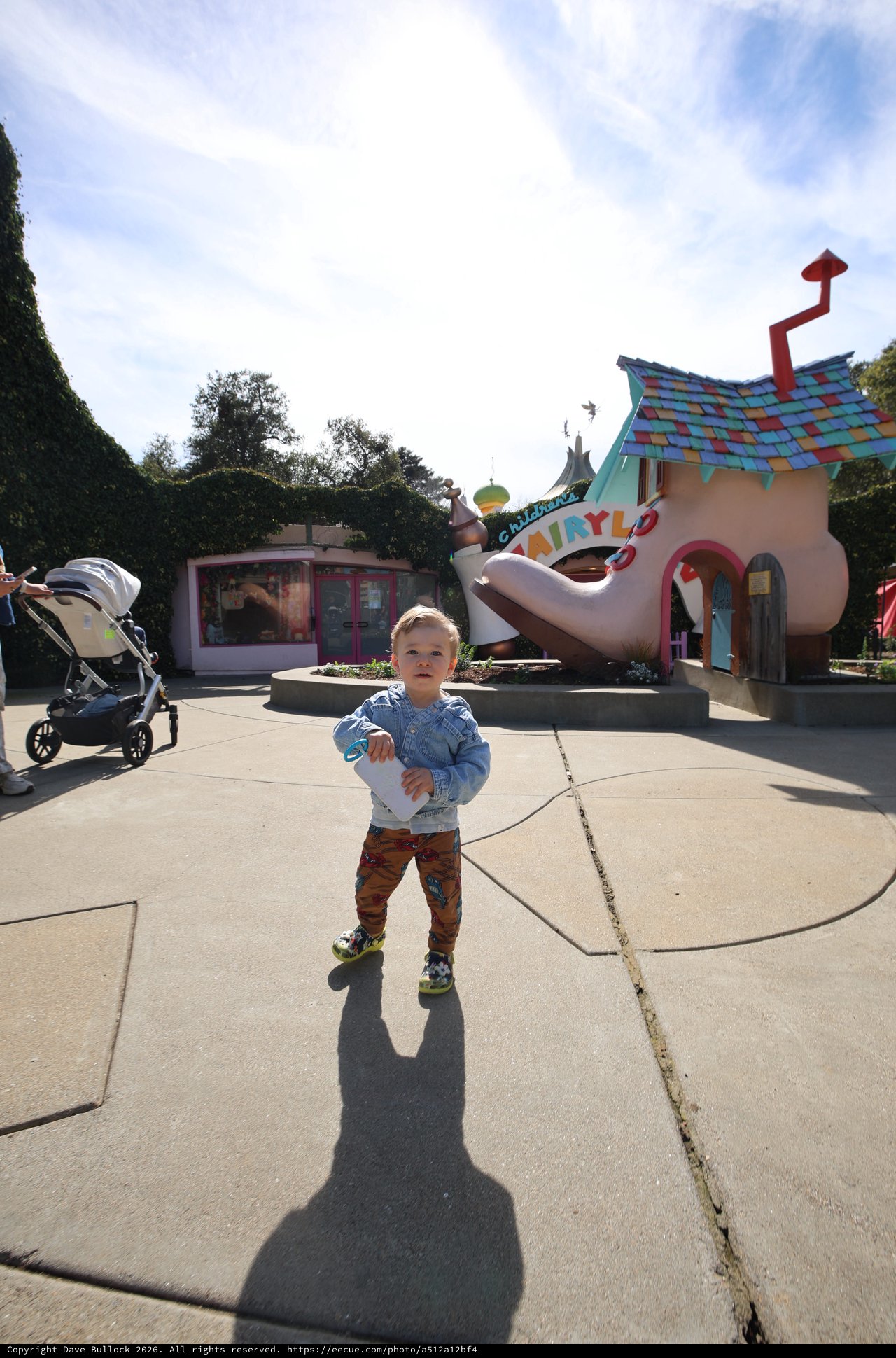 Toddler Explores Whimsical Fairytale Theme Park Area