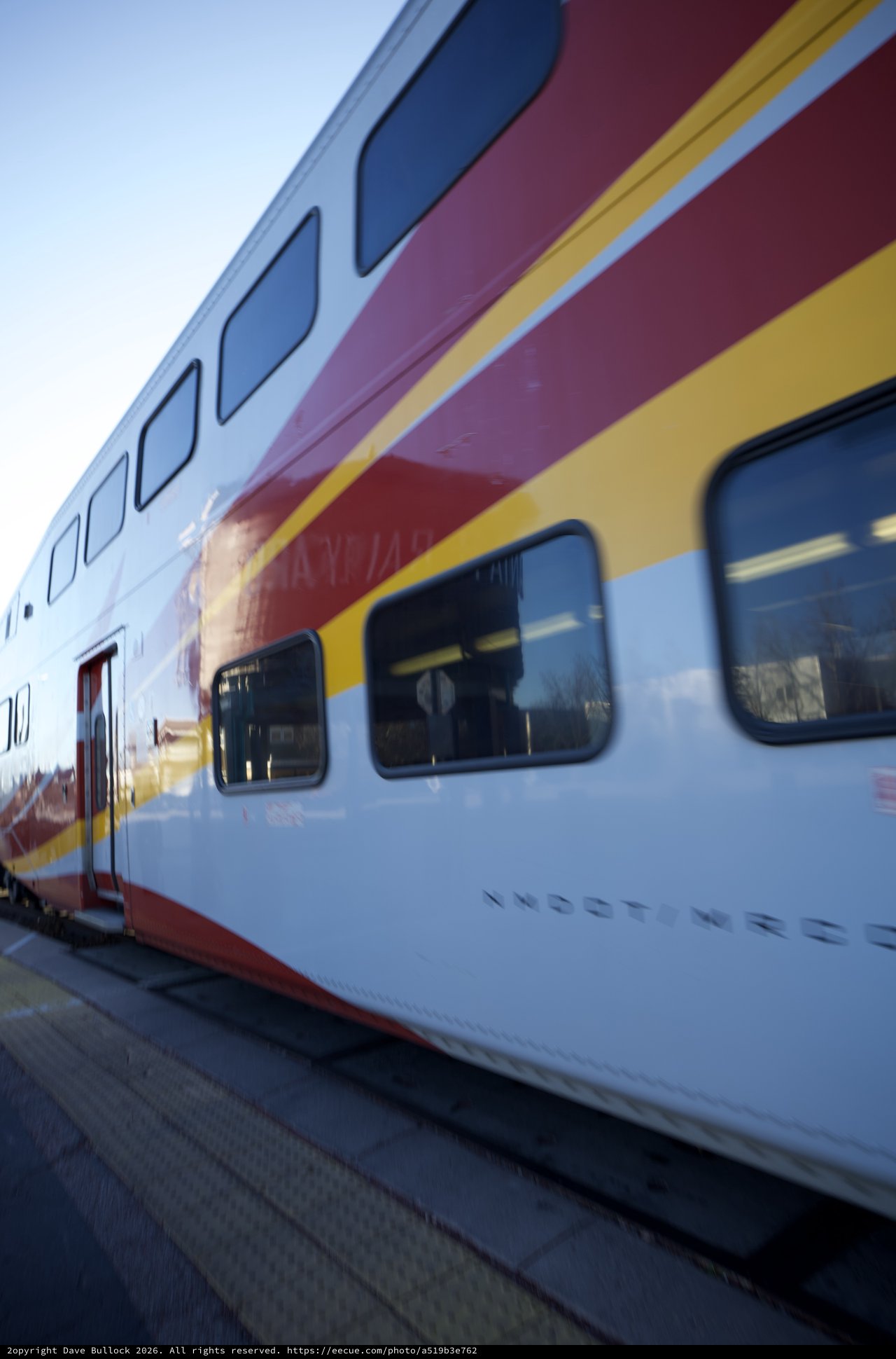 Double-Decker Rail Runner Train at Sunset Station