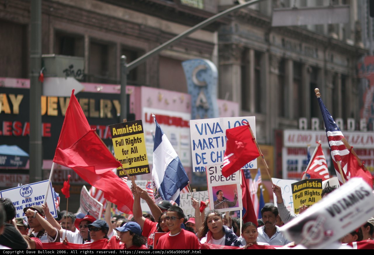 Parade of People Holding Signs and Flags in Support of Hugo Chávez