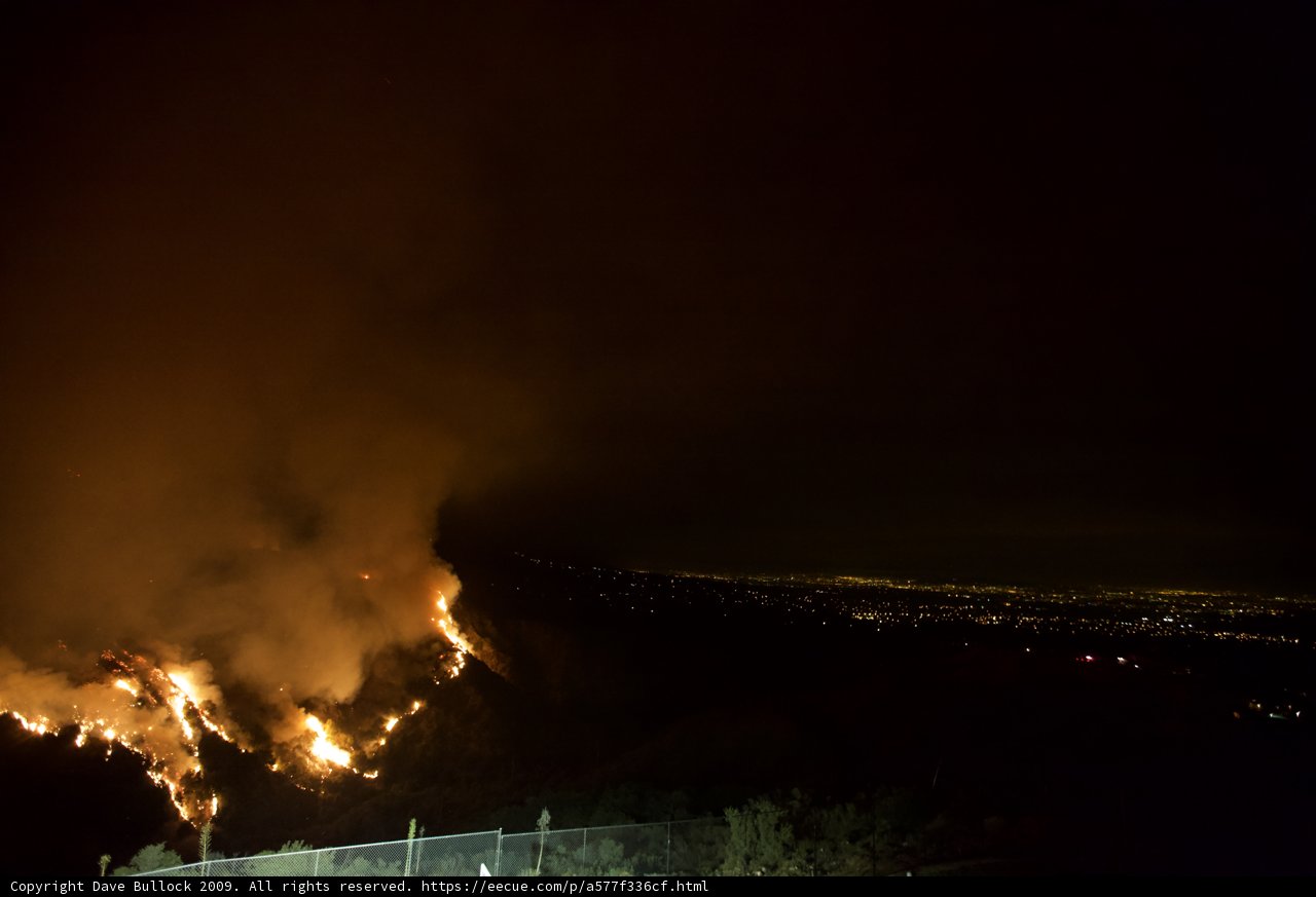 Inferno Engulfs Hills at Night