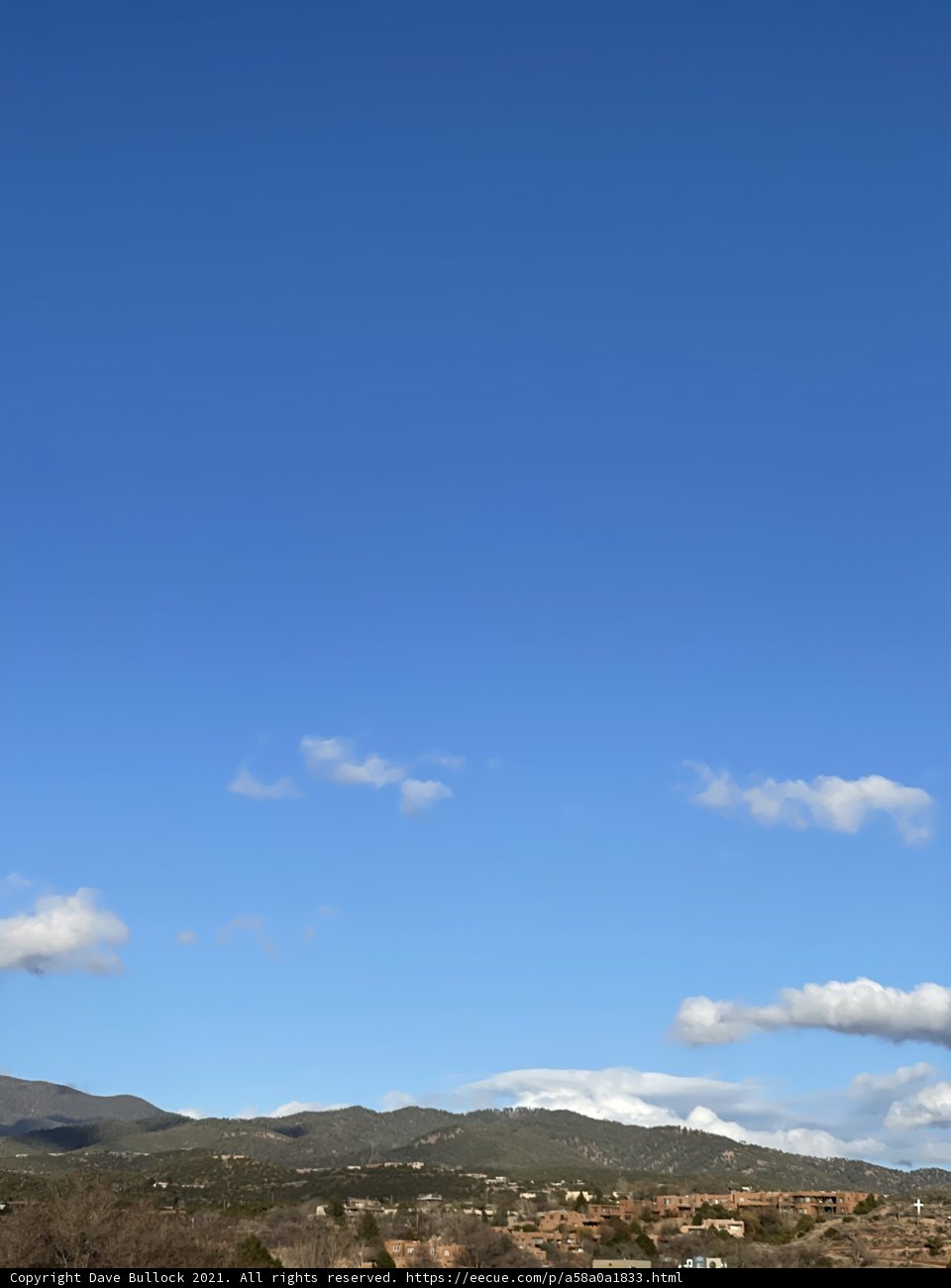 Kite soaring over picturesque Santa Fe hill