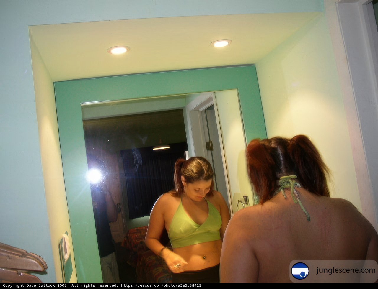 Mirror Reflection of Two Women in a Dressing Room