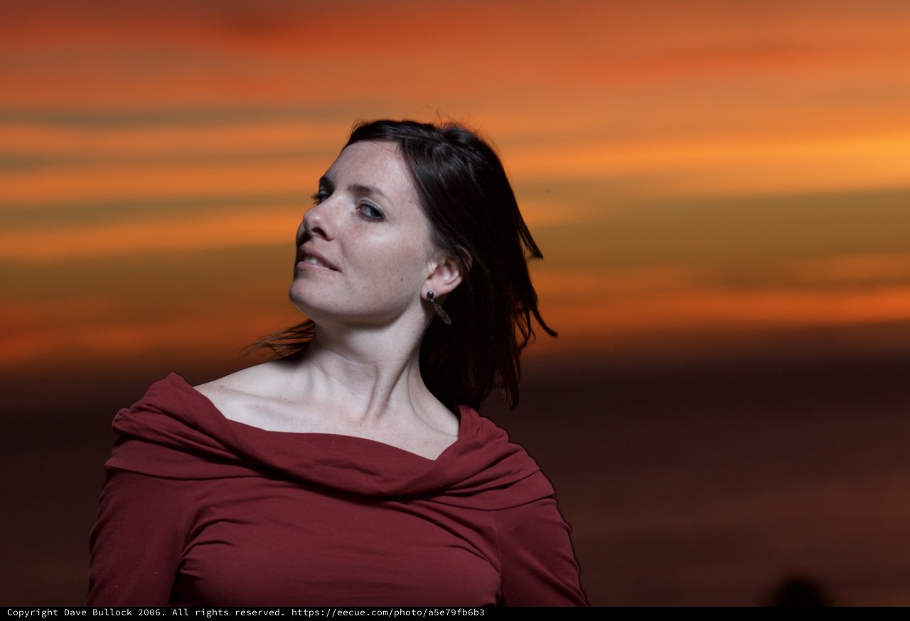 Woman Gazing Into a Fiery Sunset Sky