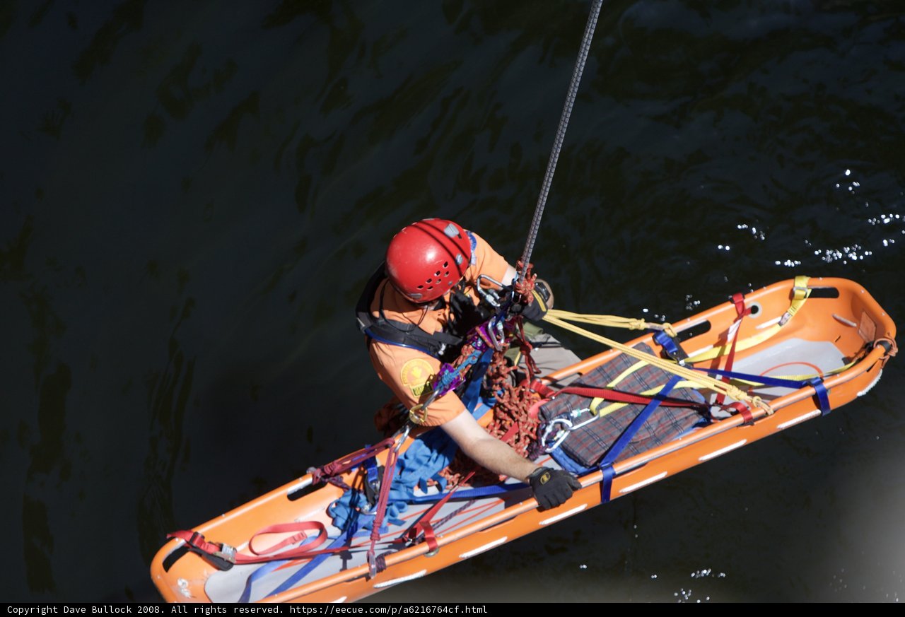 Man in Life Jacket Tackles the Waves