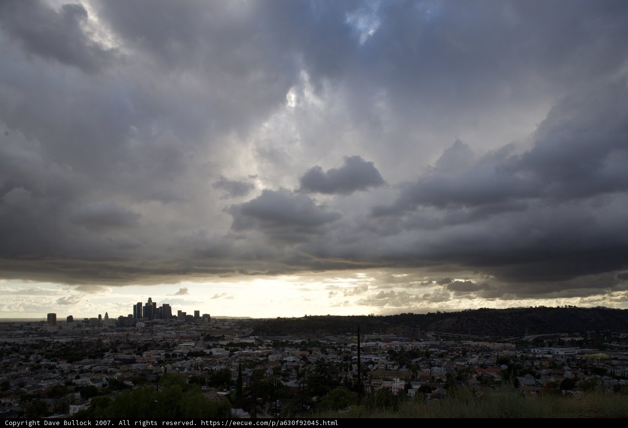 A Moody Skyline: Clouds over the City and Sea