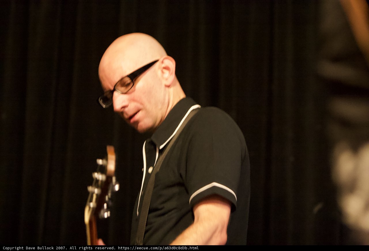 Bald Man with Glasses Shreds on Guitar