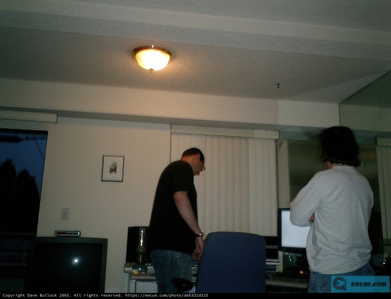 Two Men in an Electronics-filled Room
