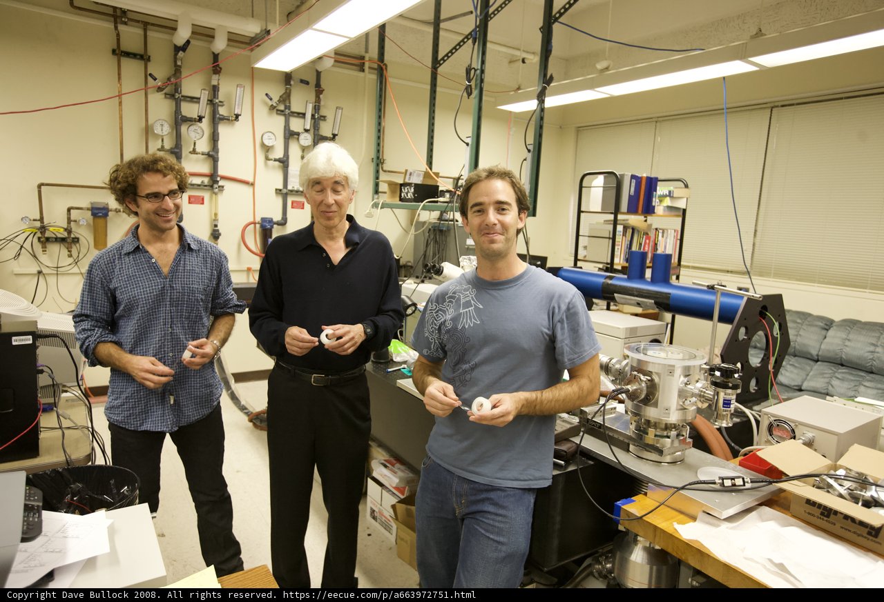 Three Men at Work in High-Tech Laboratory