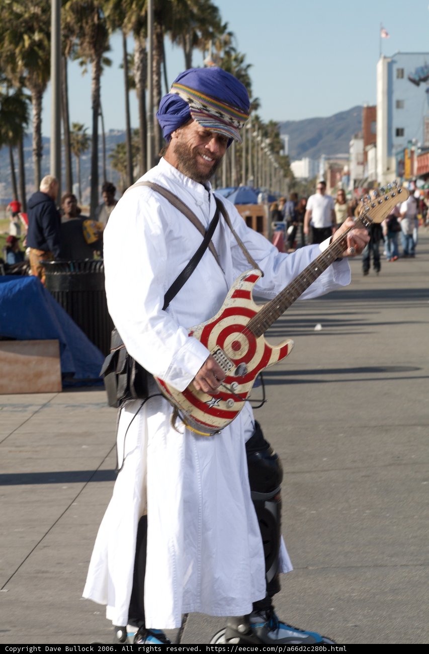 Turbaned Musician Serenades Under Blue Skies