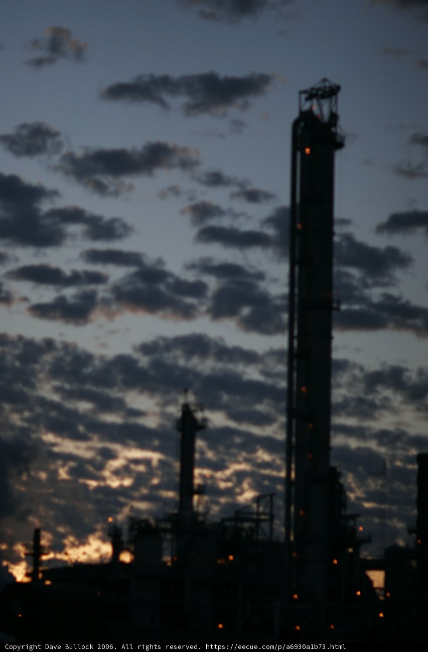 Towering Refinery Under Dark Skies
