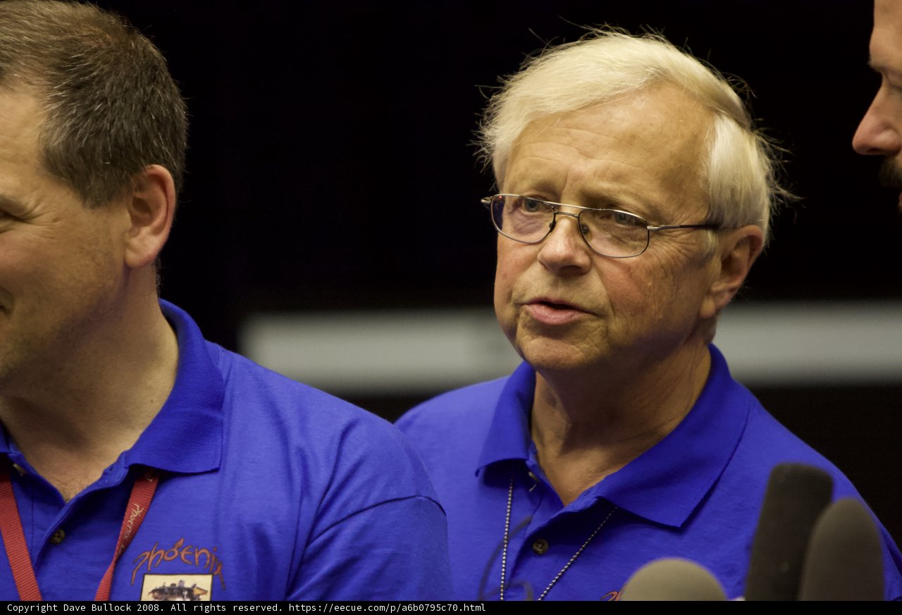 Conversation between two men in glasses