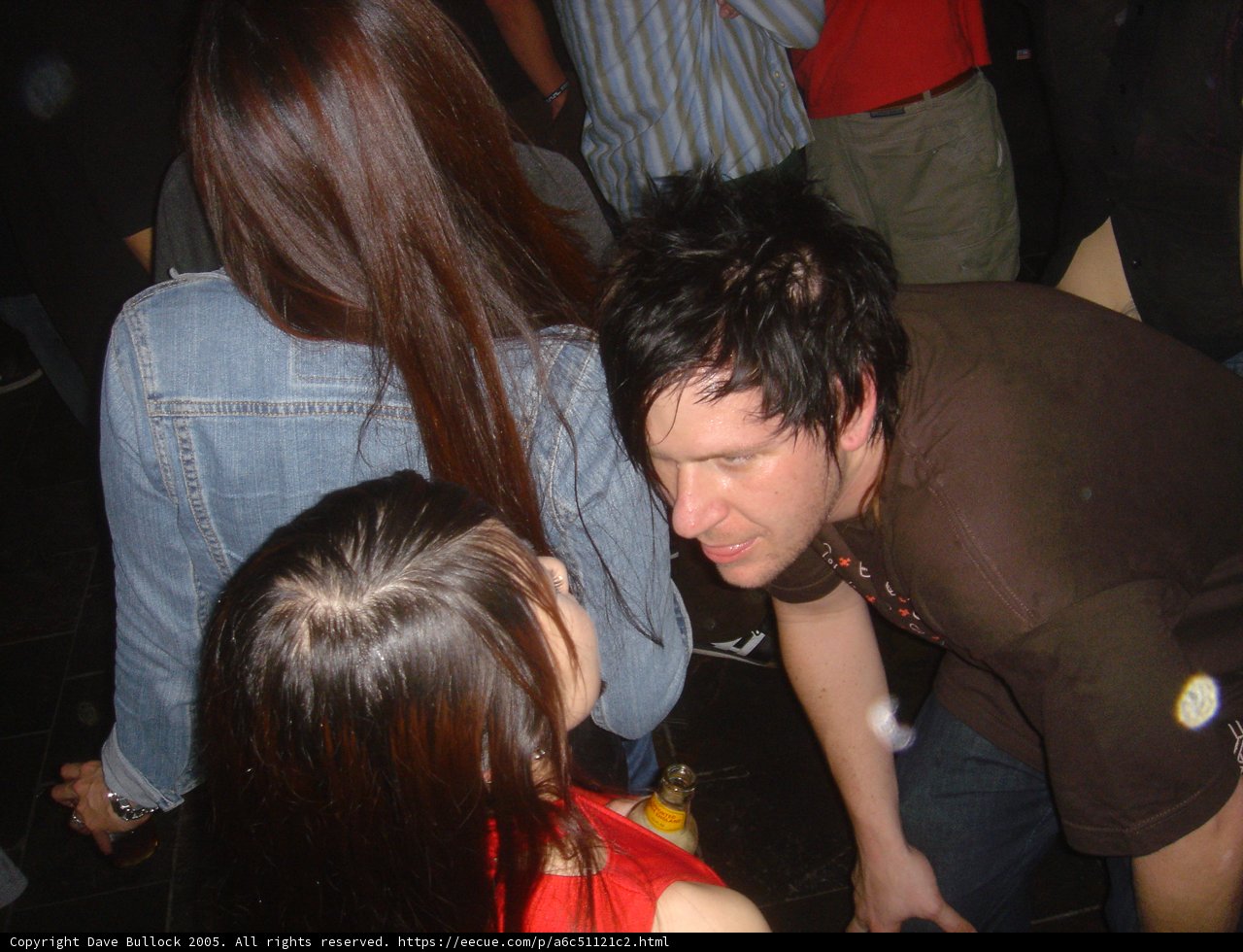 Brown Shirted Man in Night Club