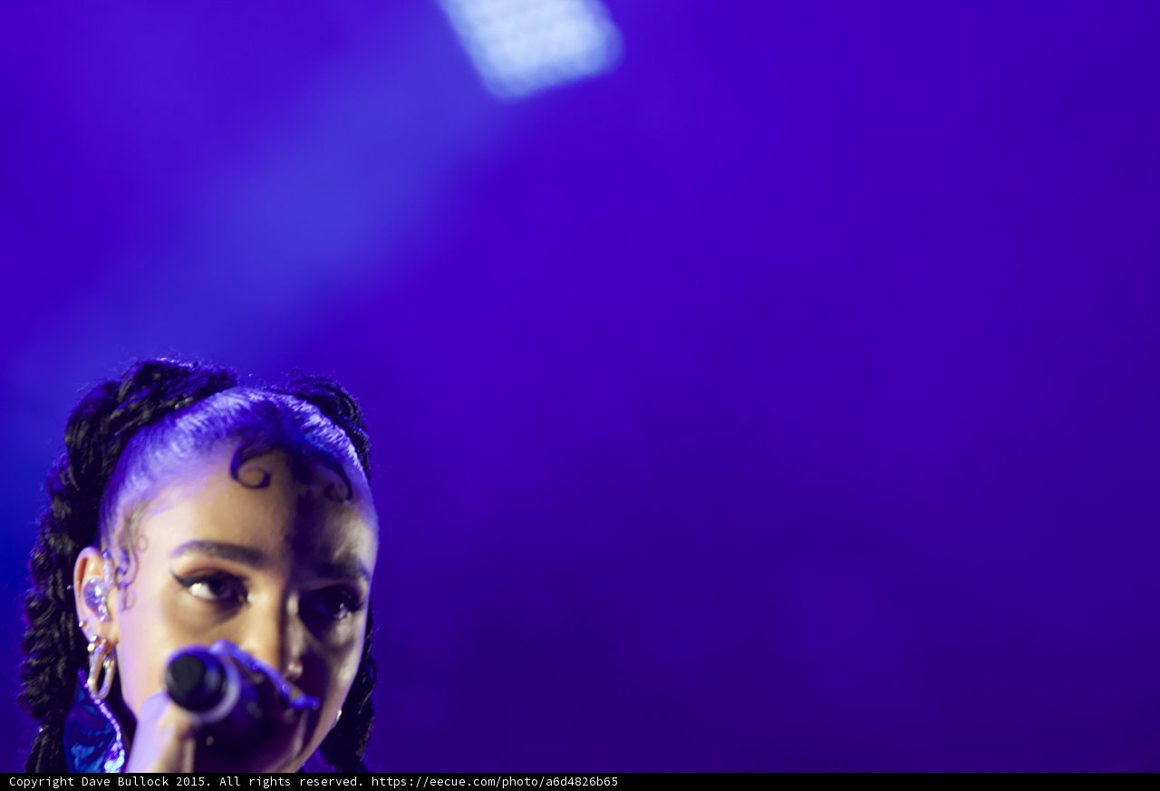FKA twigs Artistic Close-Up Portrait Face Visible Baby Hairs Swirls Cat-Eye Makeup Hoop Earrings Septum Ring Braided Ponytails Purple Blue Lighting LED Panel Negative Space