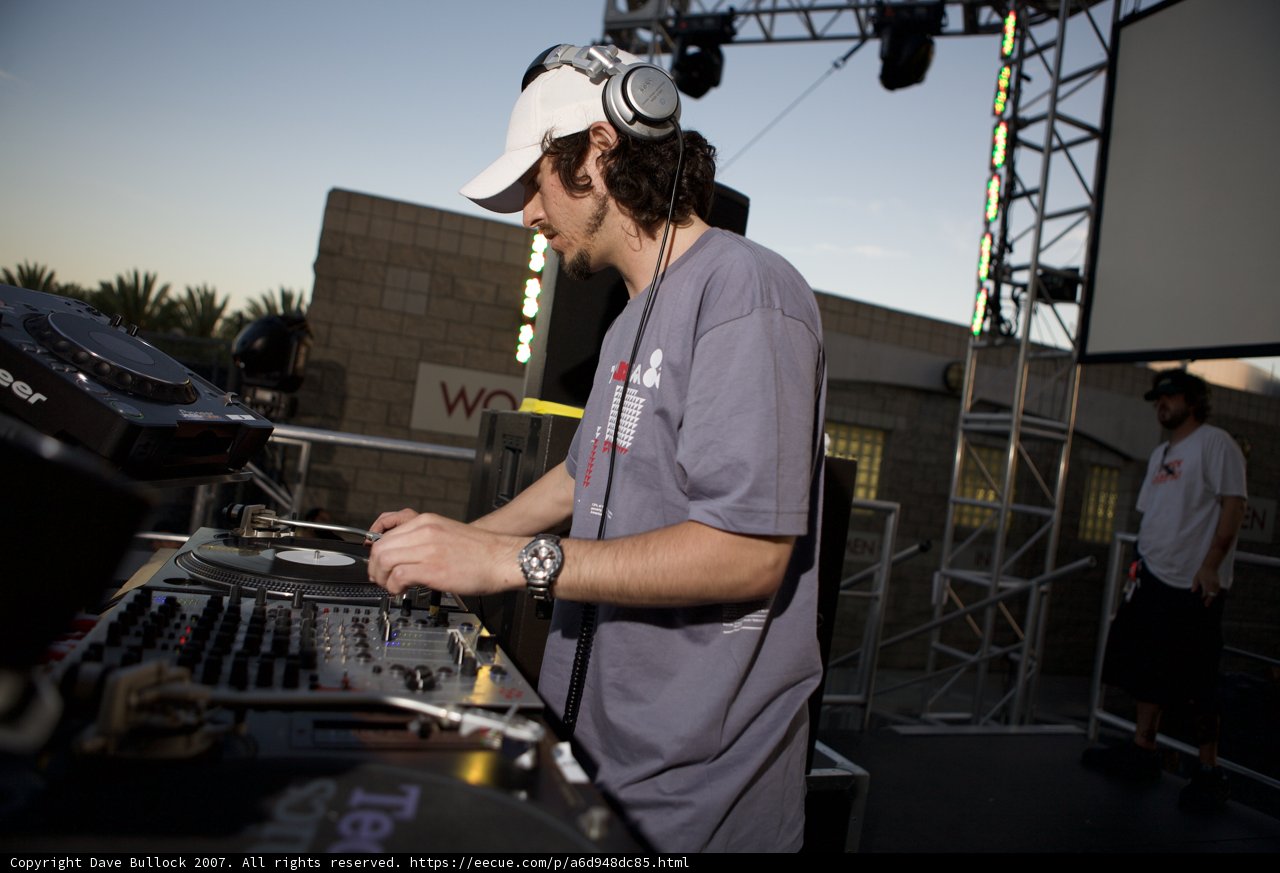 Hat-Wearing DJ Playing Turntables