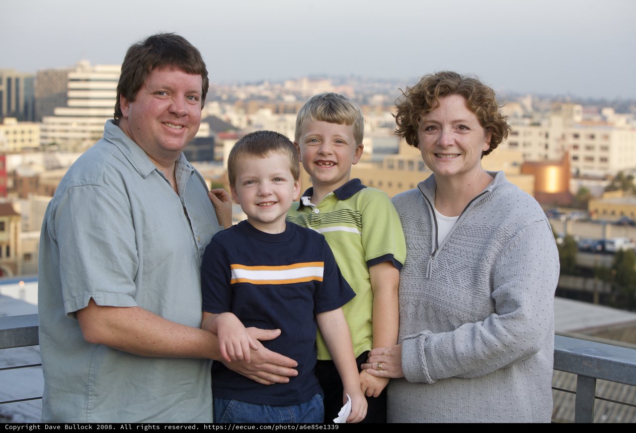 Family Portrait on Urban Rooftop at Dusk