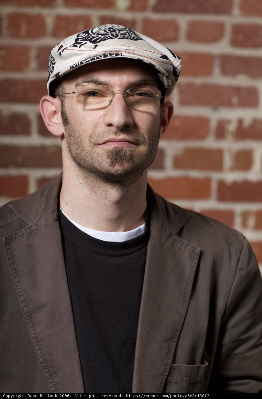 Portrait of a Happy Man in Glasses and Hat