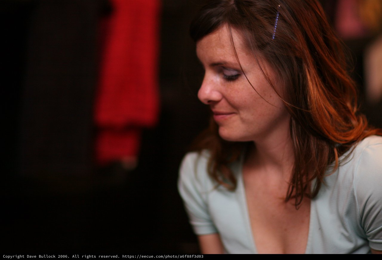 Pensive Woman in Soft Light at Evening Venue