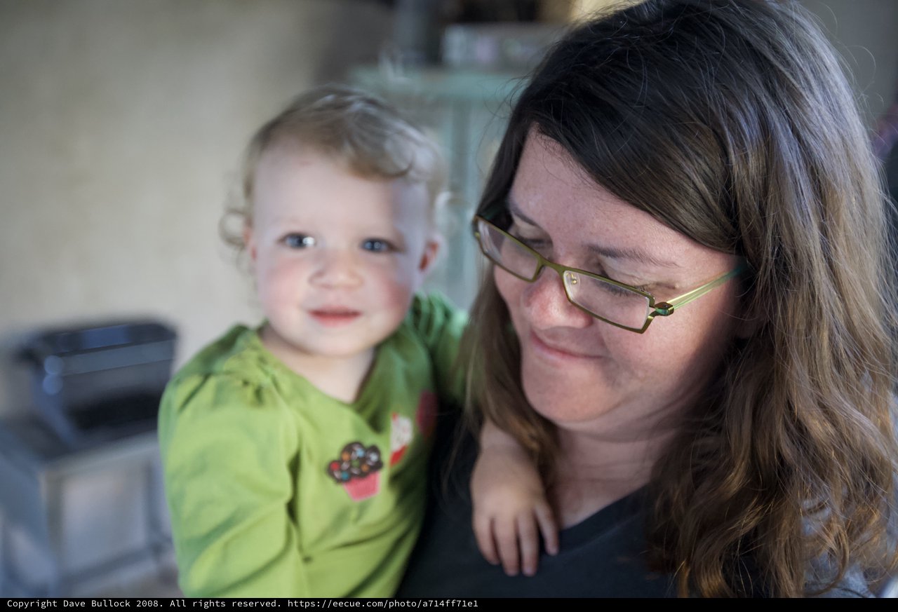 Tender Moment Between Mother and Smiling Toddler