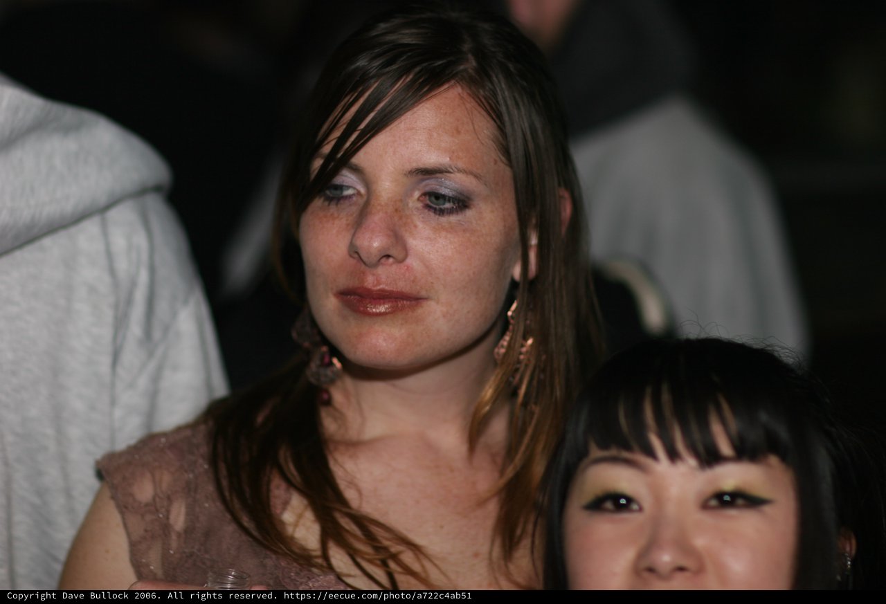 Two Women at Nightclub Event, Emotional Moment