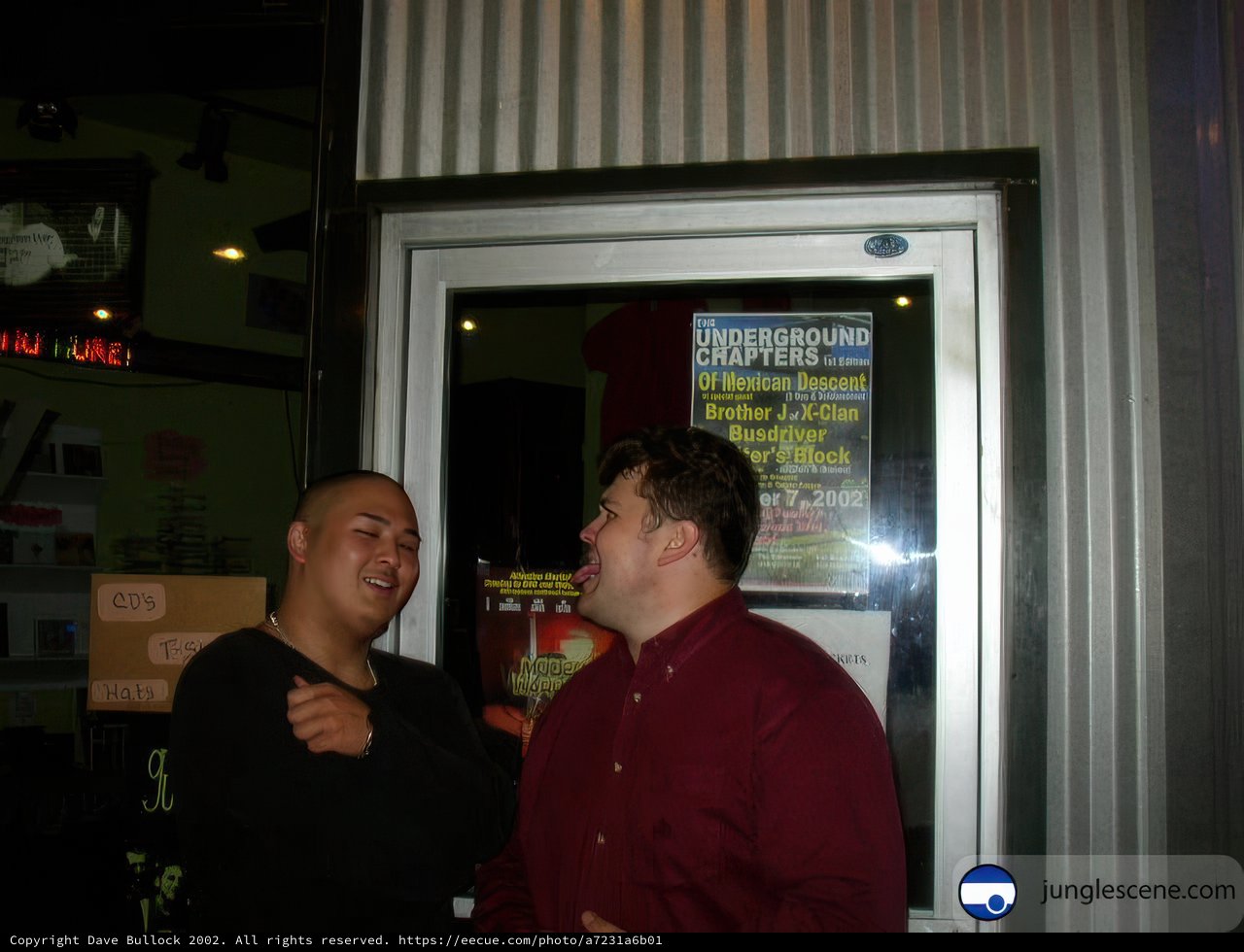 Two Men in Front of a Door