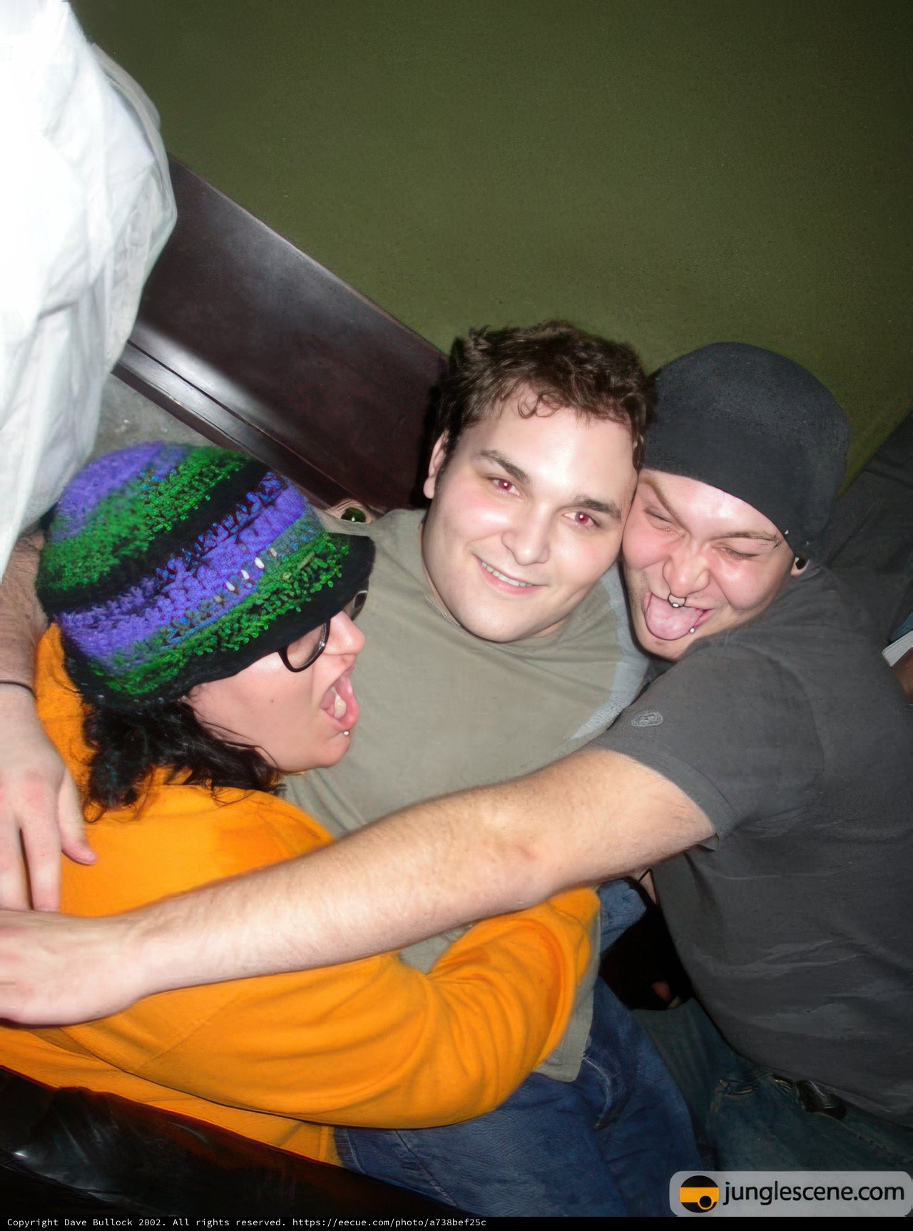 Three Men Embrace