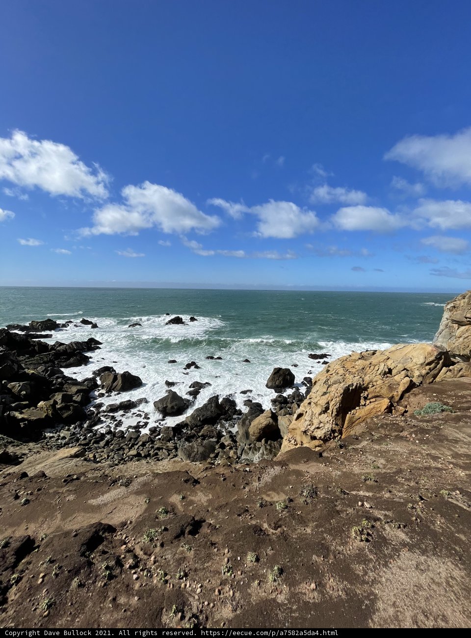 Rocky Cliffs Meet Azure Waters