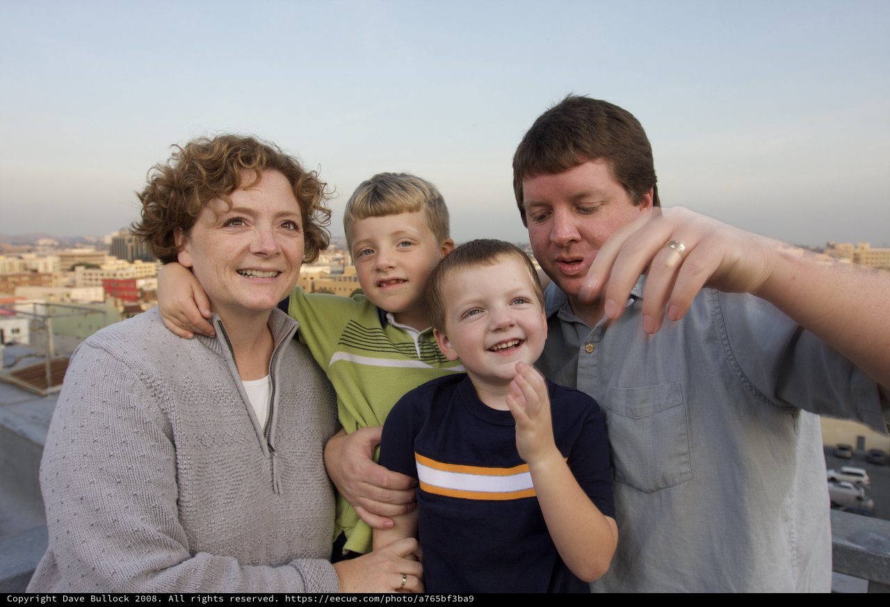 Family Rooftop Portrait at City Sunset