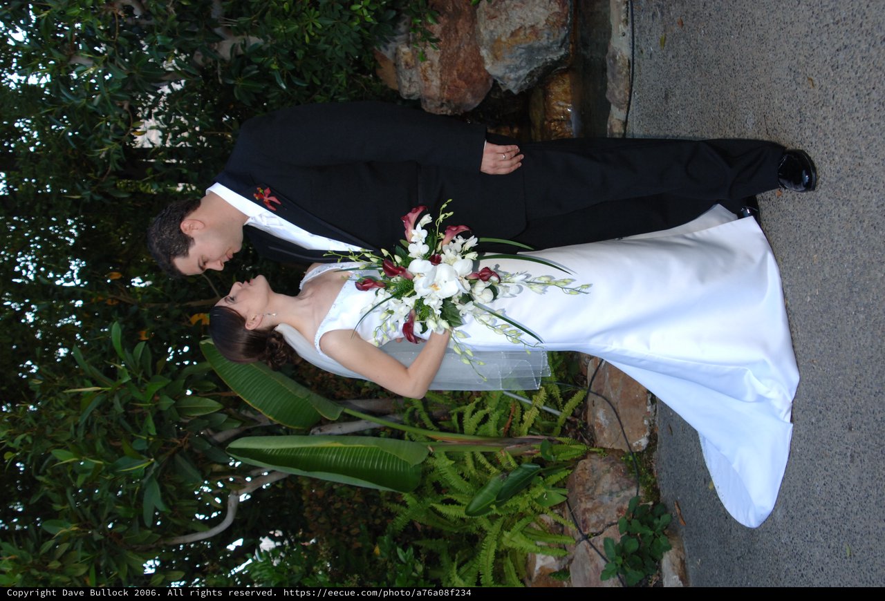 Bride and Groom Share Romantic Garden Wedding Moment