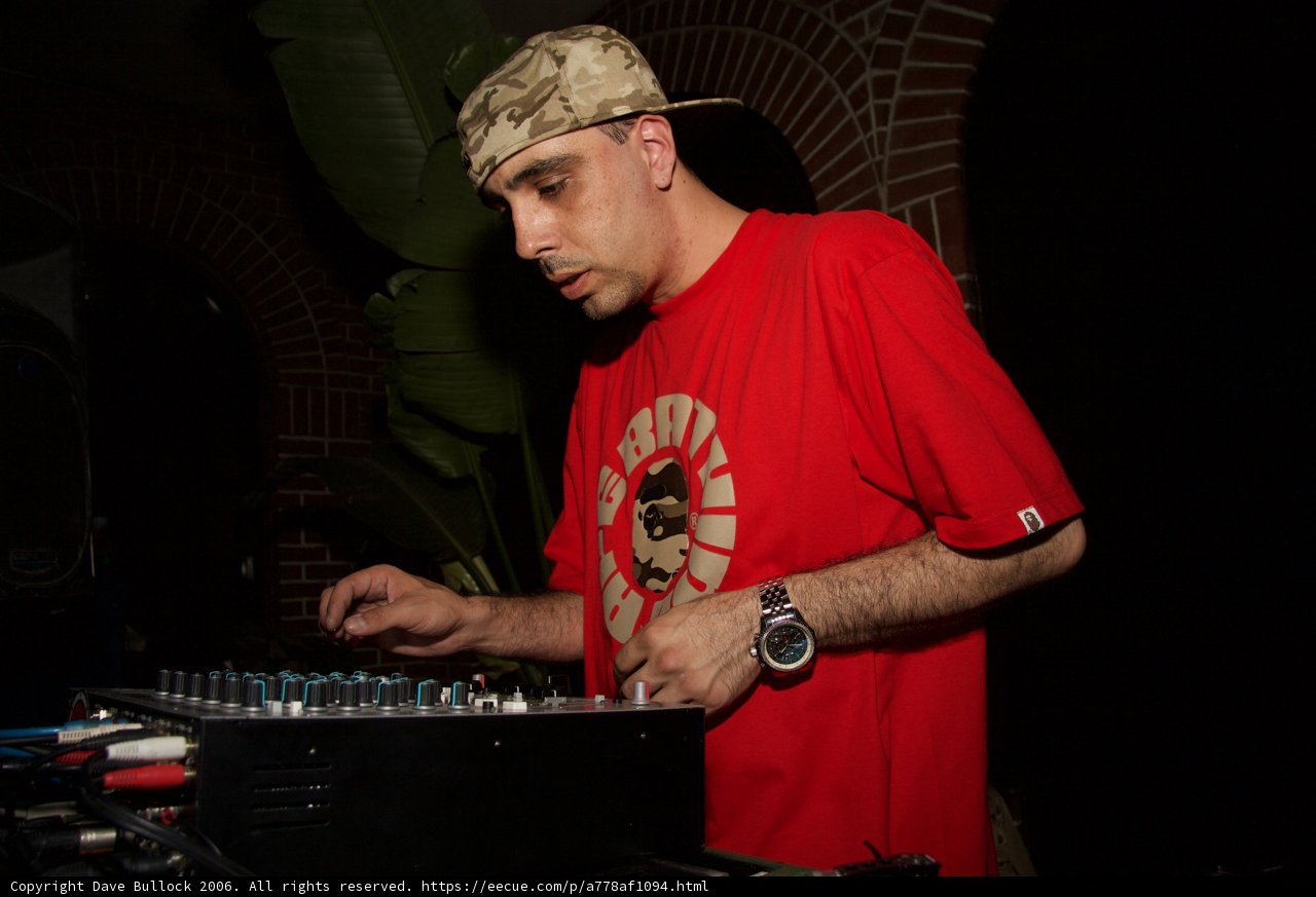 Red-Shirted Deejay Spinning the Time Away