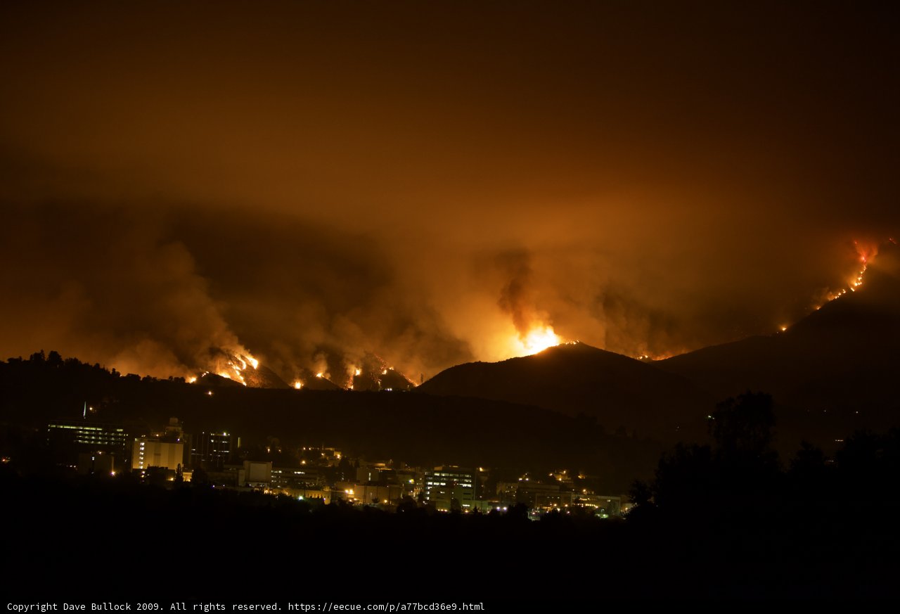Flames Engulf the Hills Above the City