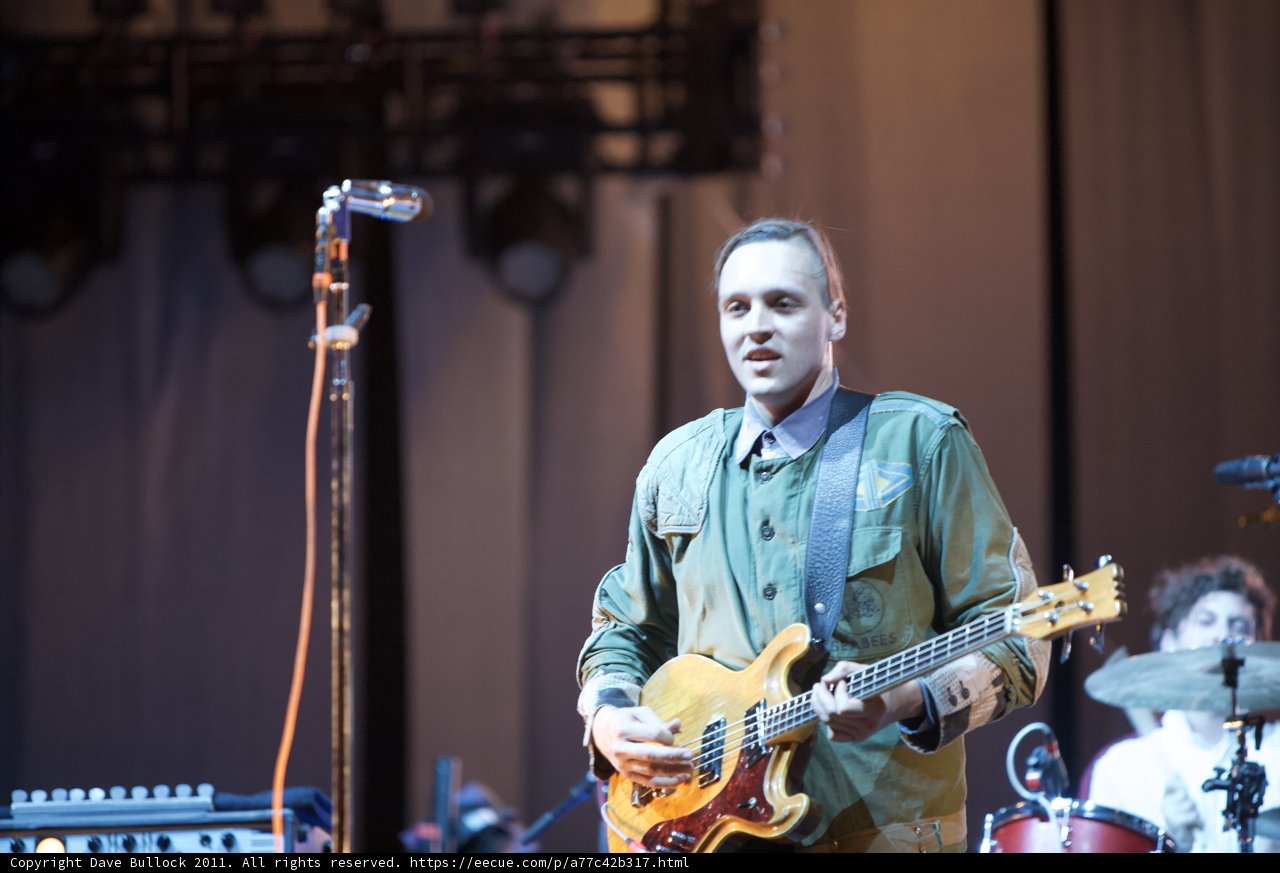 Win Butler rocks the stage with his guitar at Coachella 2011